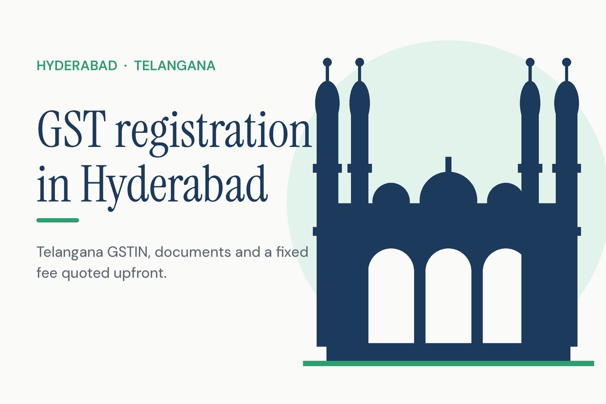 GST registration form with a green tick, certificate, calculator and invoices on a desk, with a small Charminar silhouette